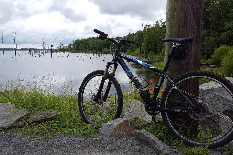 Free Image of Mountain Bike By A Lake 