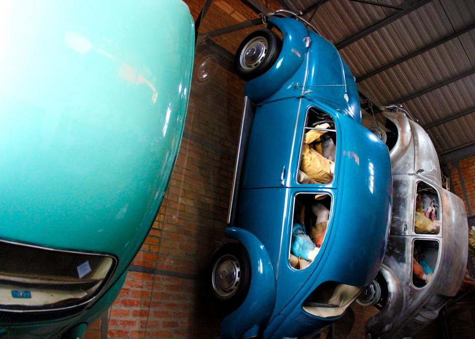 Free Image of Cars Perched on Wall - Exhibition - Installation - Art 