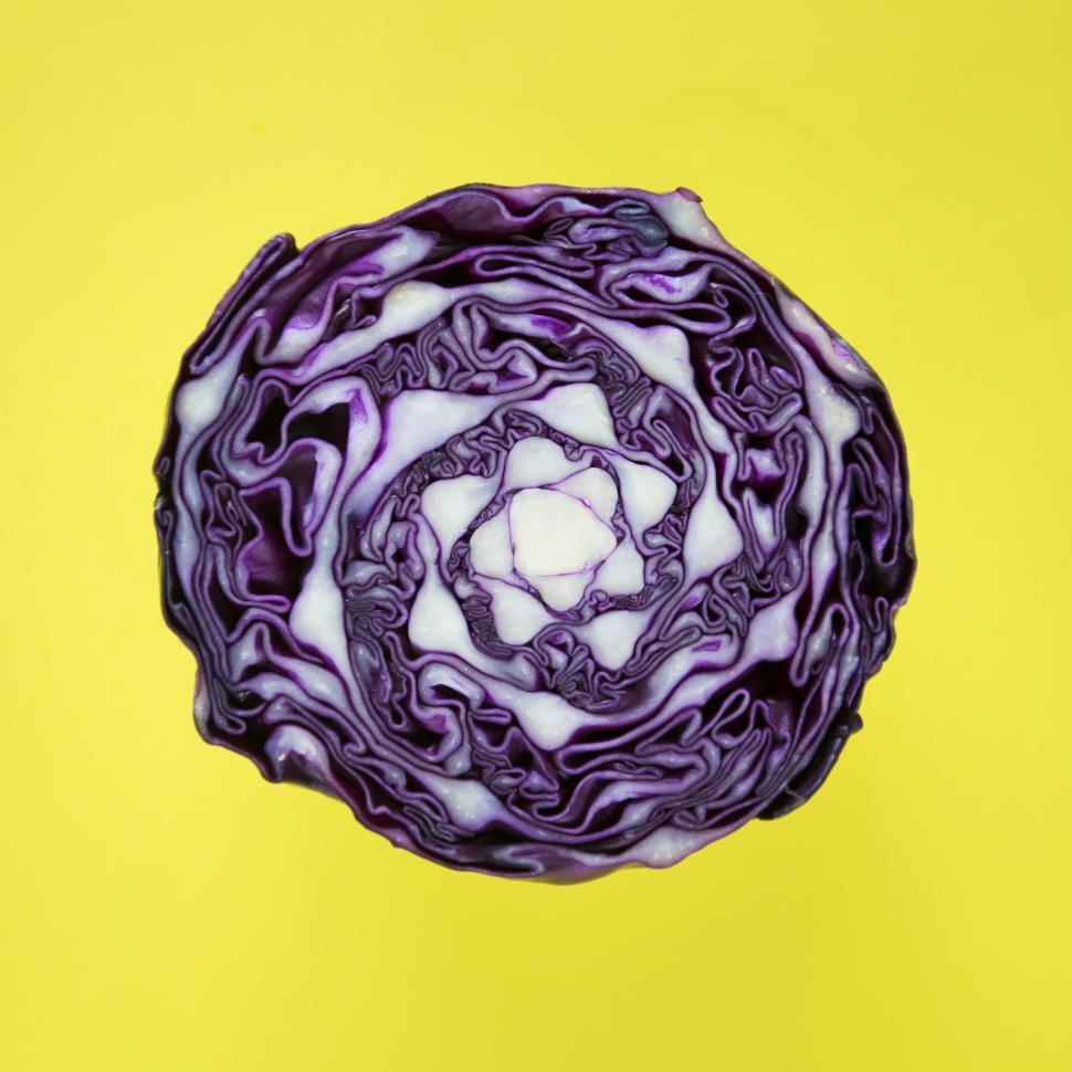 Free Image of Flat lay of purple cabbage on yellow surface 