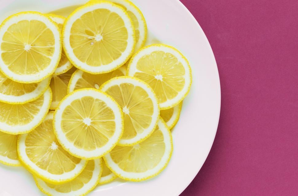 Free Image of Flat lay of lemon slices on white plate 