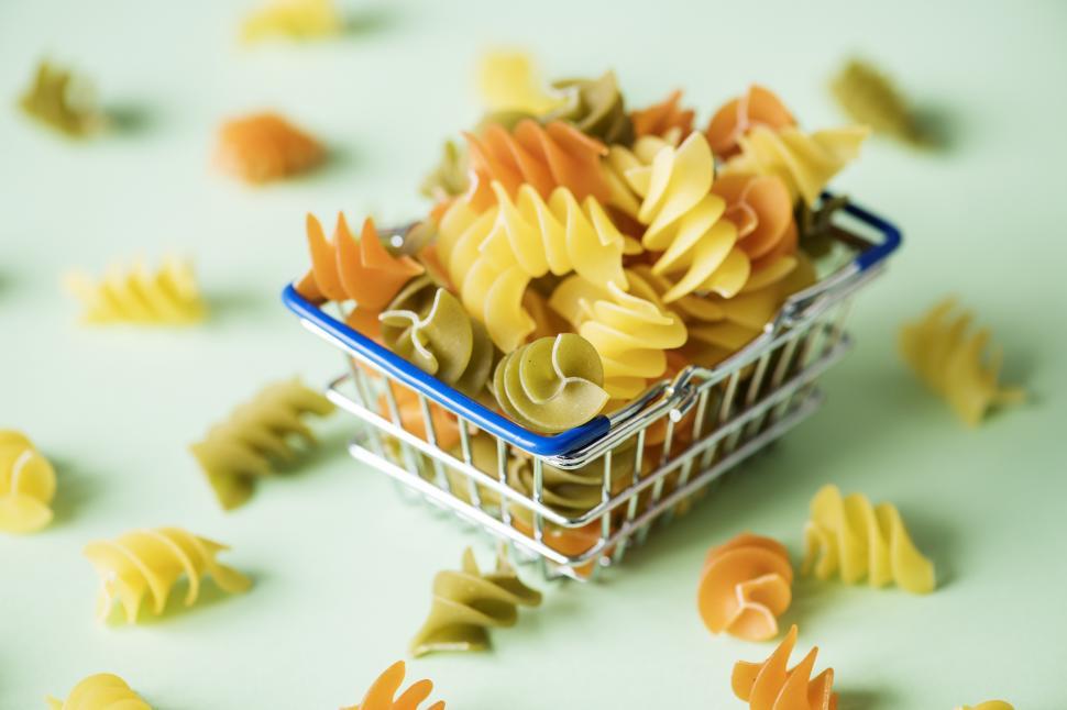 Free Image of Rotini Spirals pasta in a steel wire basket 