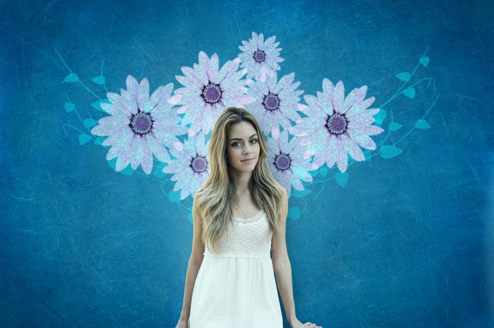 Free Image of Attractive Young Woman Over Blue Wall with Flowers 