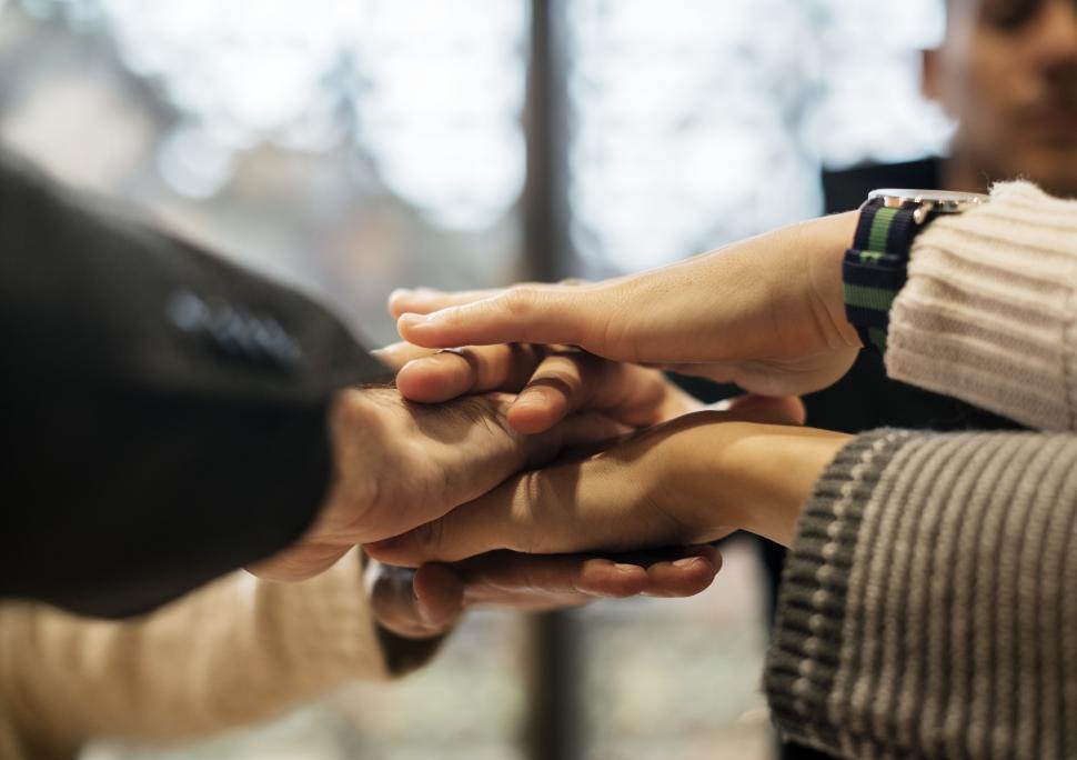 Download Free Stock Photo of Hands stacked together in solidarity after a meeting 