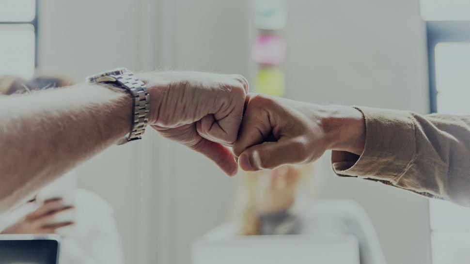 Free Image of Colleagues giving Fist Bump in agreement 