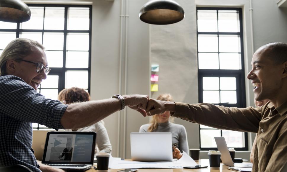 Free Image of Colleagues in meeting giving Fist Bump in agreement 