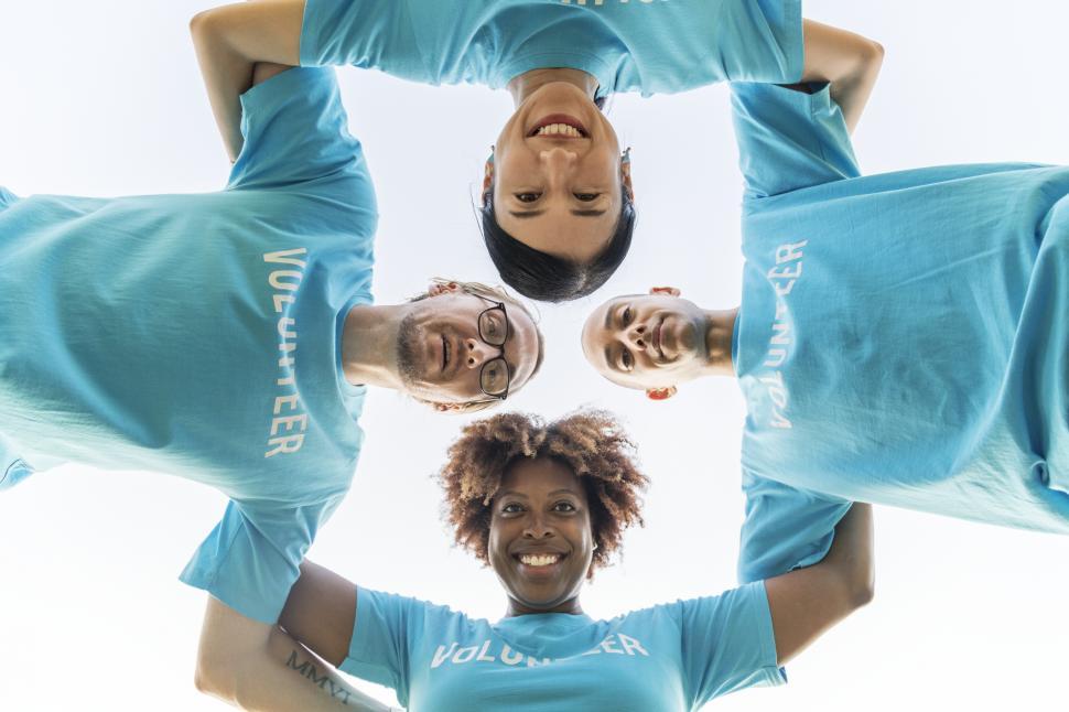 Free Image of Low angle view looking up a group of volunteers 