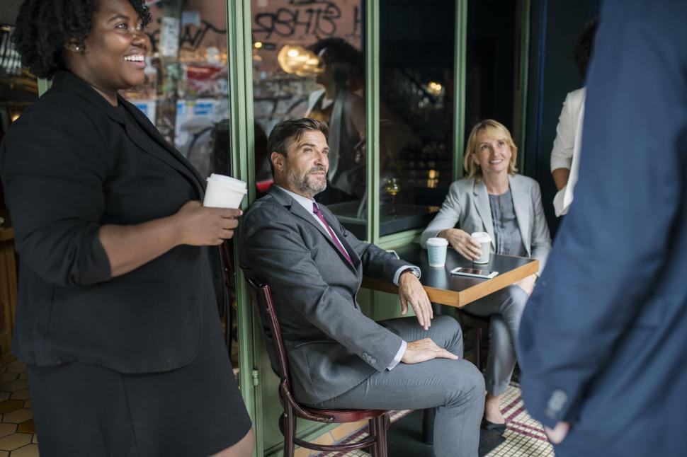 Free Image of Business man with colleagues at a cafe 