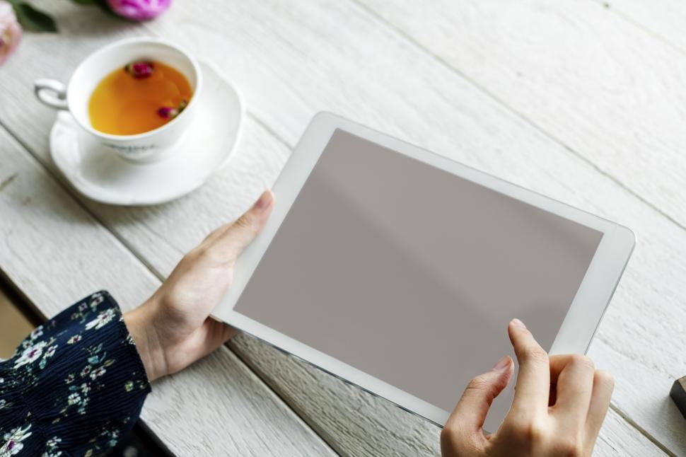 Free Image of Close up of hands holding a blank tablet PC 