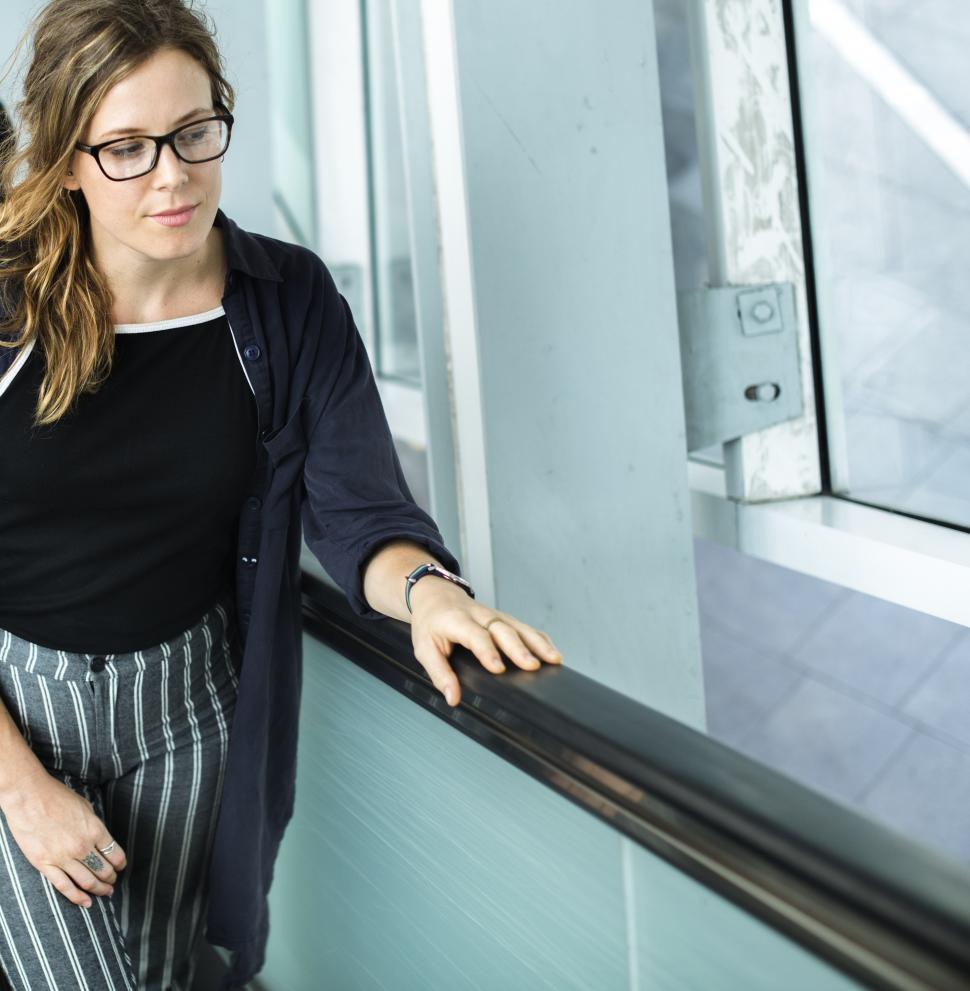 Free Image of A young woman on the escalator 