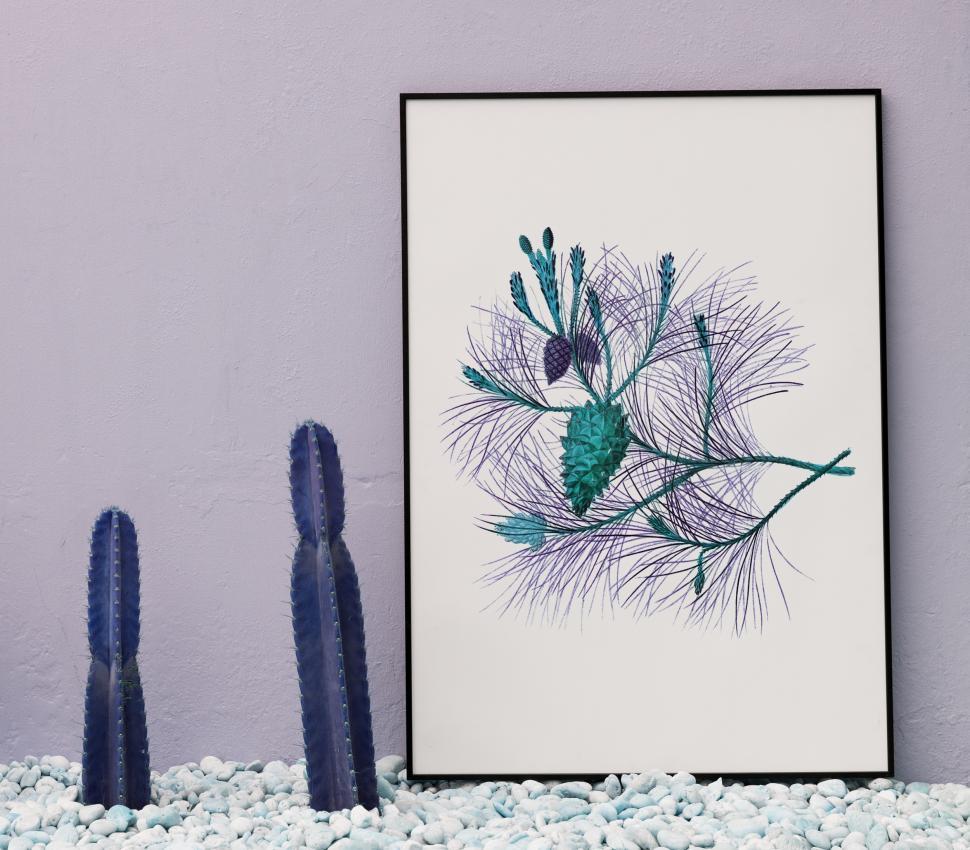 Free Image of Home decor with a picture and cactus plants 