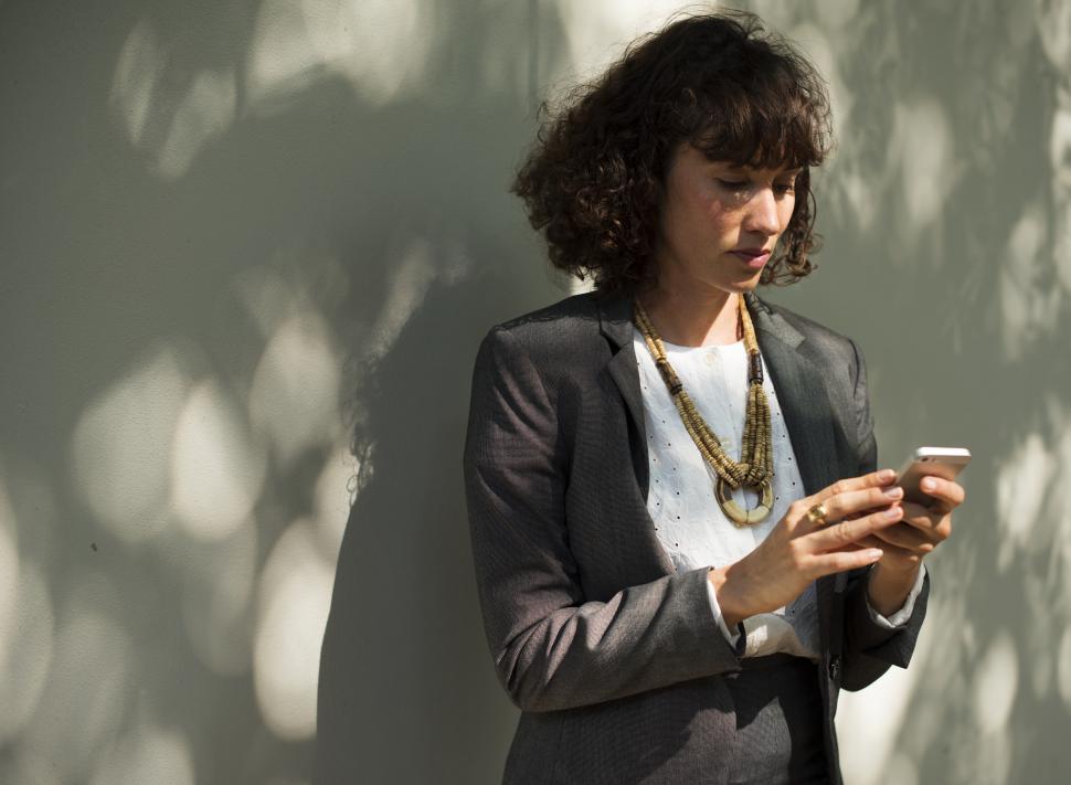 Free Image of A young business woman on her mobile phone 