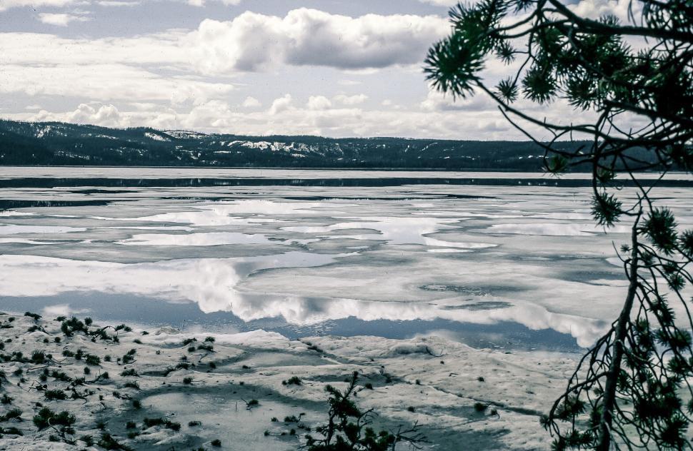 Free Image of Frozen Lake with Cloud Reflections 
