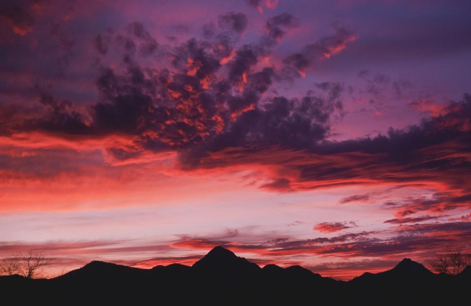 Free Image of Orange clouds Silhouette Mountains 