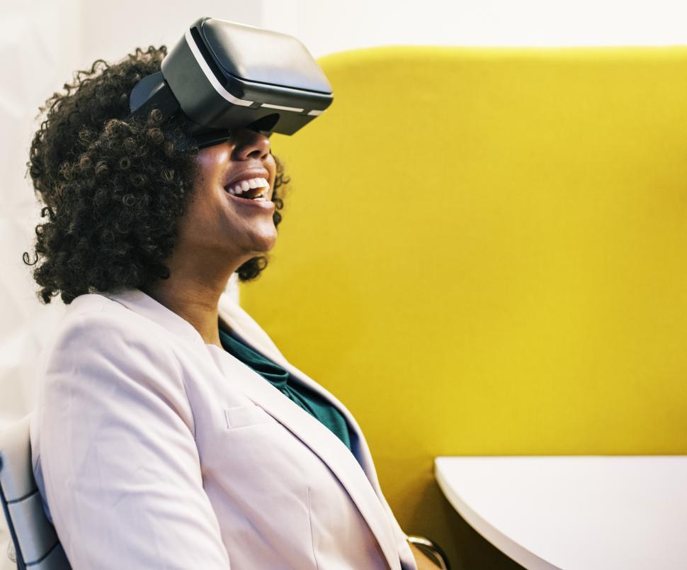 Free Image of Woman experiencing virtual reality with headset 