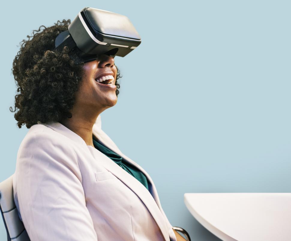 Free Image of Happy woman wearing a virtual reality headset 