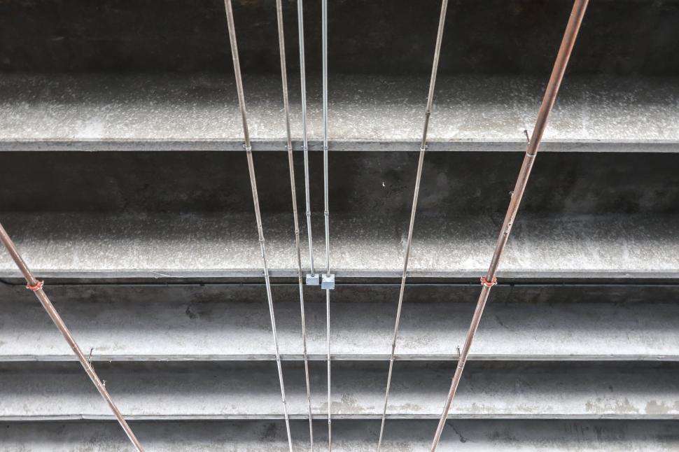 Free Image of Electrical Conduit on Concrete Beams 