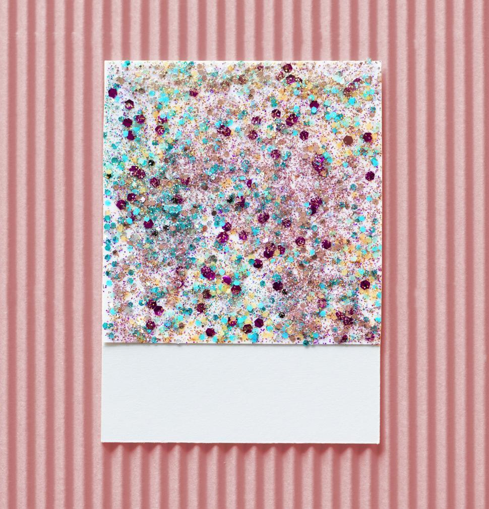 Free Image of Flat lay of glitter sparkles on spaced cardboard frame 