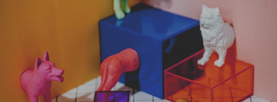 Free Image of Colorful toy animals with geometric glass figures 