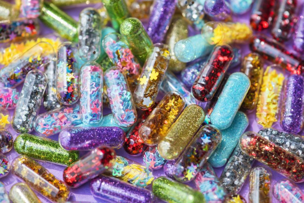 Free Image of Close up of colorful glitter pills 