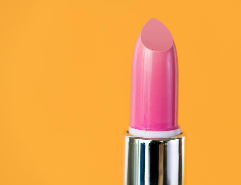 Free Image of Close up of bright pink twisted up lipstick 