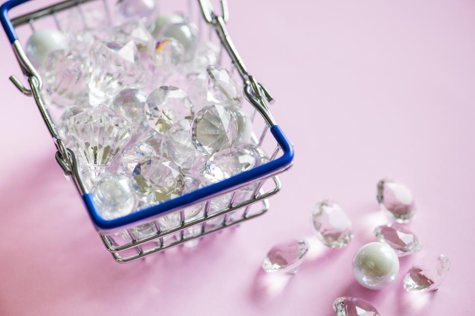 Free Image of Crystals and marbles in a steel wire basket 