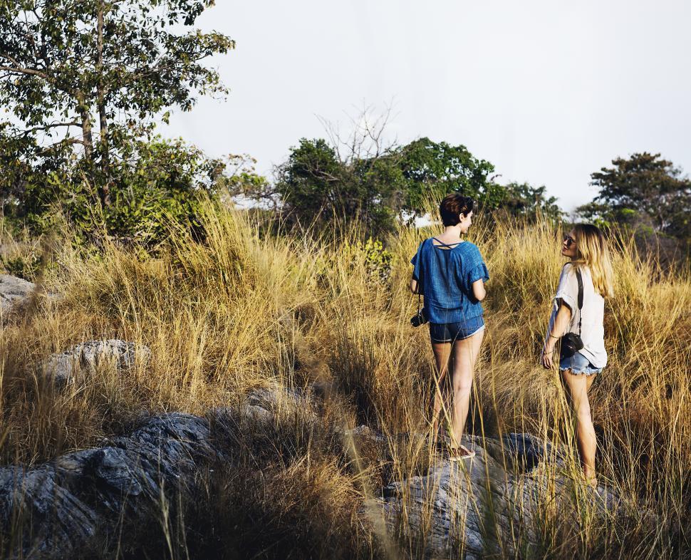Free Image of Two relaxed young caucasian women hiking in the forest 