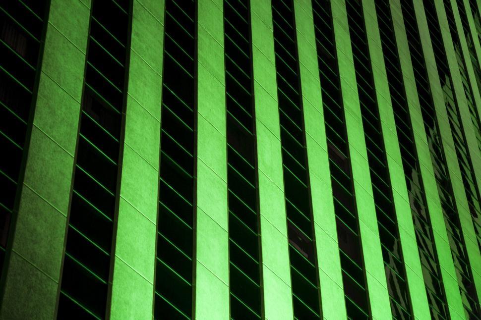 Free Image of glowing green building background 