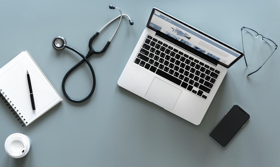 Download Free Stock Photo of Overhead view of a laptop and a stethoscope - medical work 