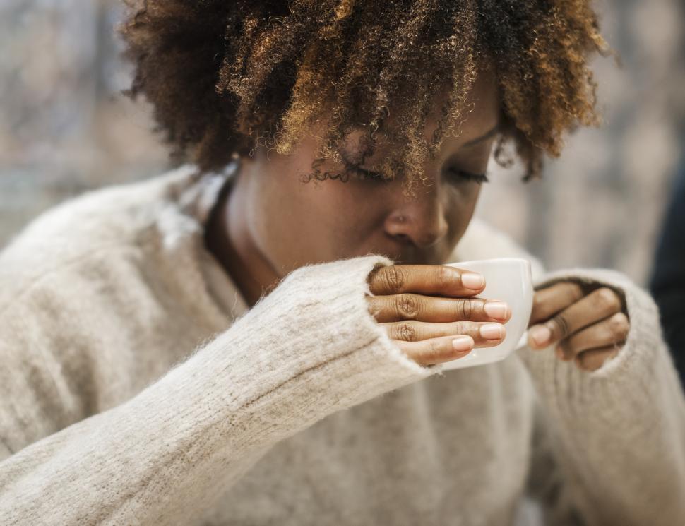 Free Image of Close up of an African ethnicity woman drinking coffee 