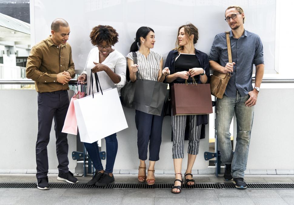 Free Image of A group of multiethnic shoppers with bags of purchases 