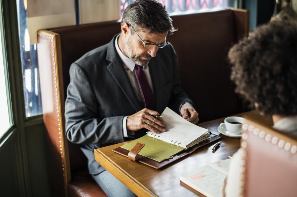 Free Image of A senior businessman at a cafe 
