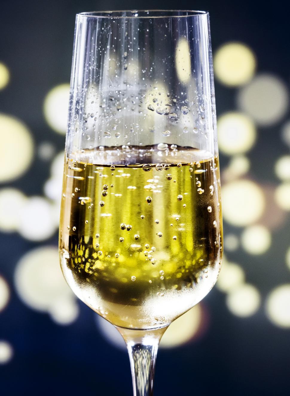 Free Image of Alternate close up of a champagne glass, dark background 
