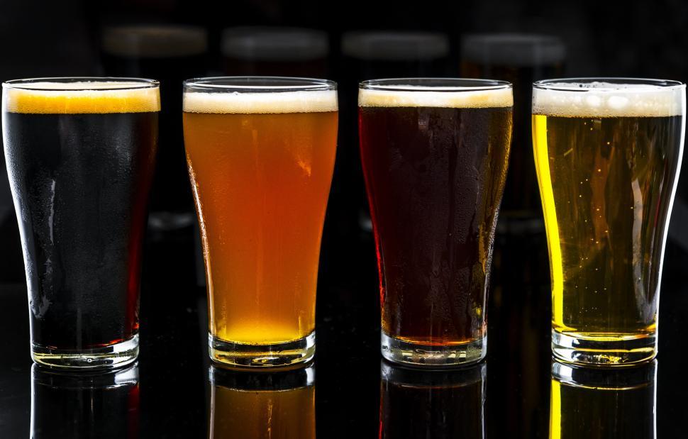 Free Image of Dramatic close up of beer served in pint glasses 