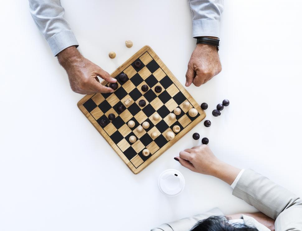 Free Image of Overhead view of two people playing chess 