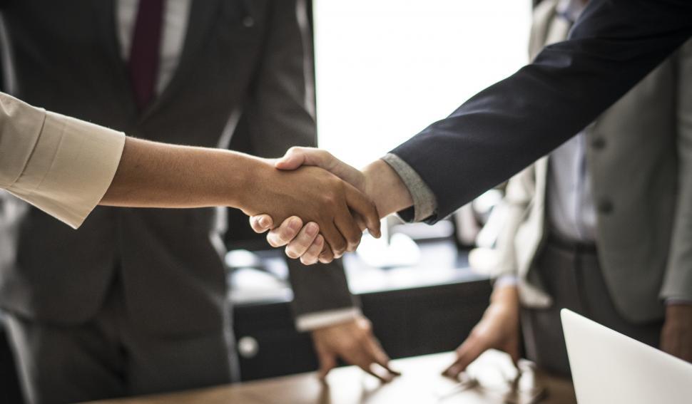 Free Image of Business people shaking hands in agreement 