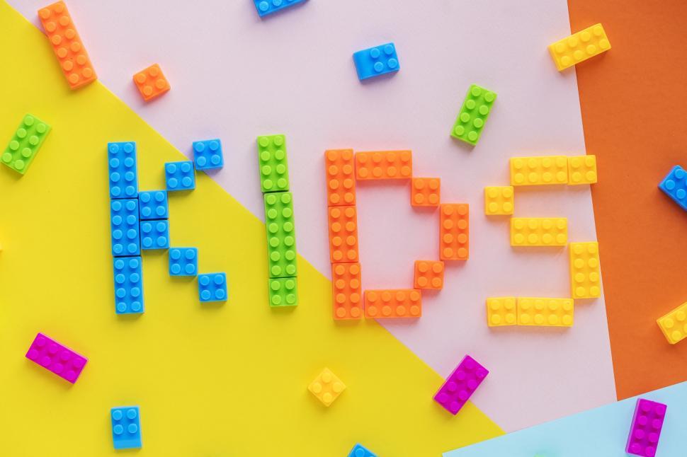 Free Image of Flat lay of the text KIDS written with plastic toy bricks 