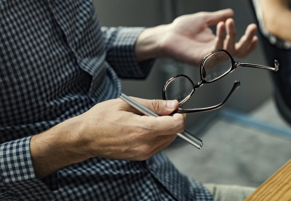 Free Image of Close up of spectacles in a person s hand 