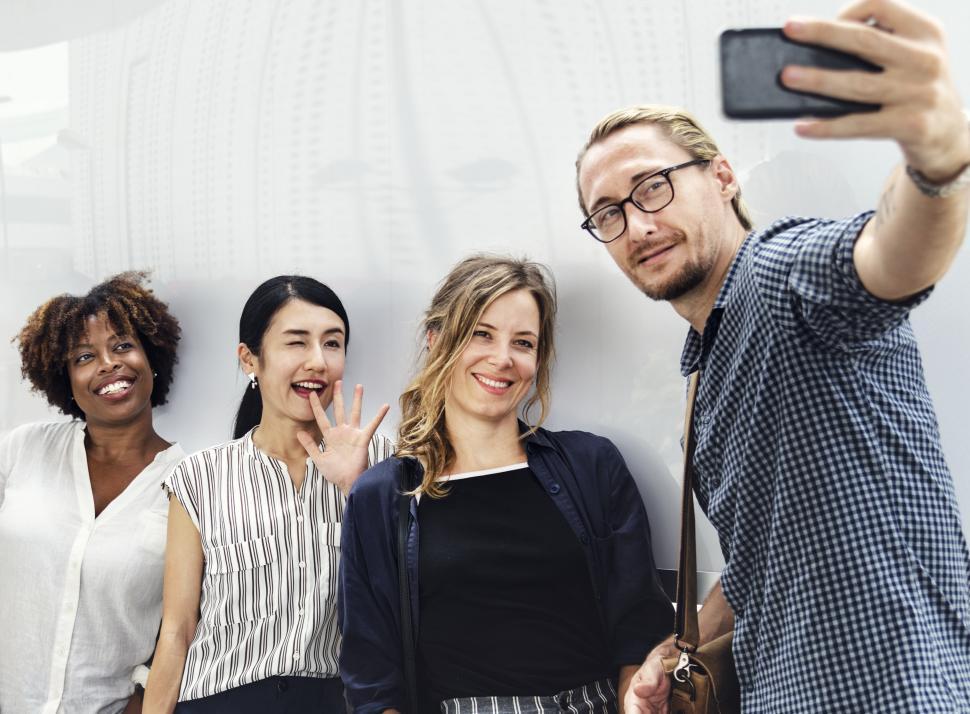 Free Image of A group of people taking a group selfie 