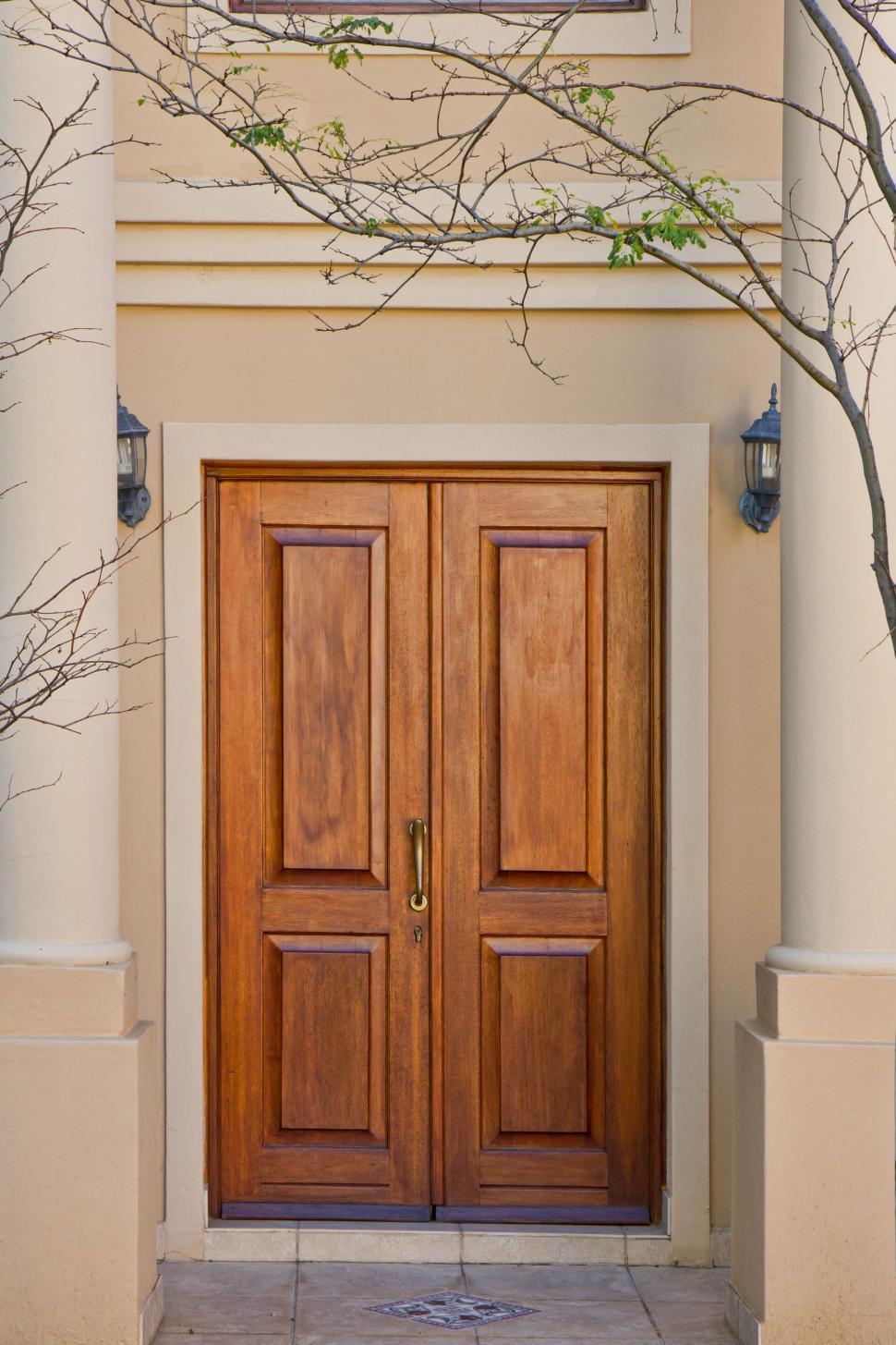 Free Image of Wooden Doors Leading to House Entrance 
