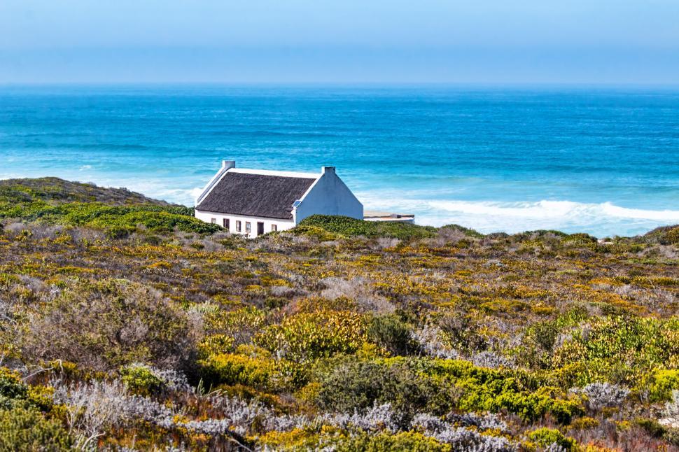 Free Image of cottage seaside bush shrubs sky vacation sea ocean summer serene peaceful relax landscape southern cape de hoop nature reserve south africa ecology idyllic 