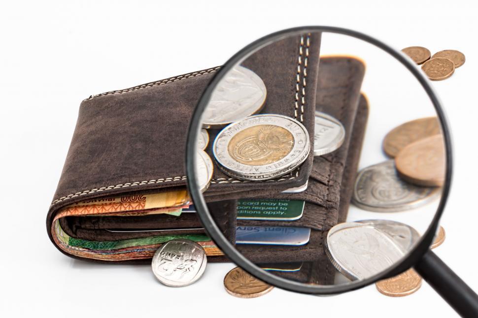 Free Image of Magnifying Glass and Wallet Full of Coins 