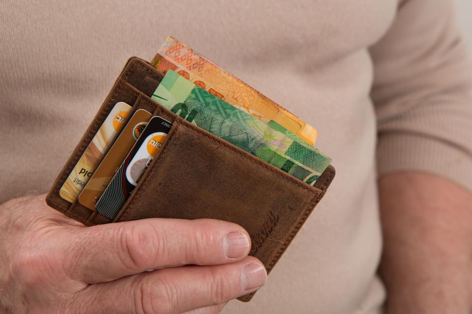 Free Image of Man Holding Wallet Full of Money 