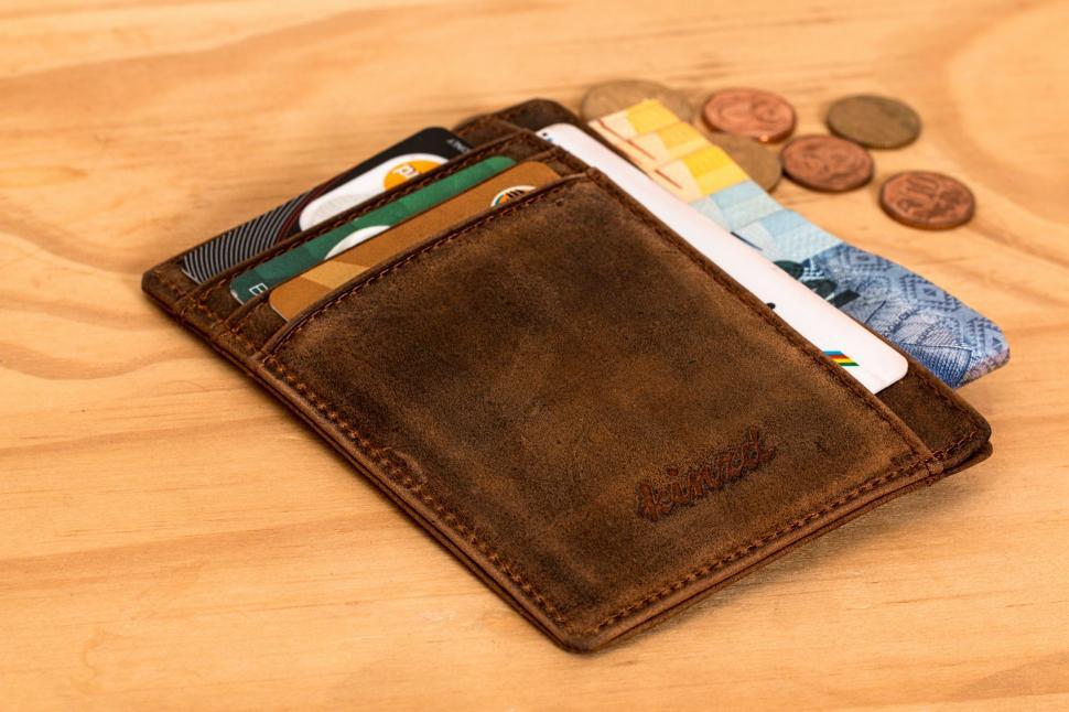 Free Image of wallet credit card cash investment money financial finance financial planning shopping paying commerce business wealth buy payment currency poor rich budget savings banking purchase banknote coin pay economy 