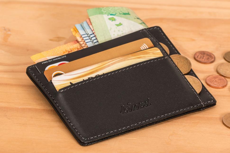 Free Image of Black Leather Wallet on Wooden Table 