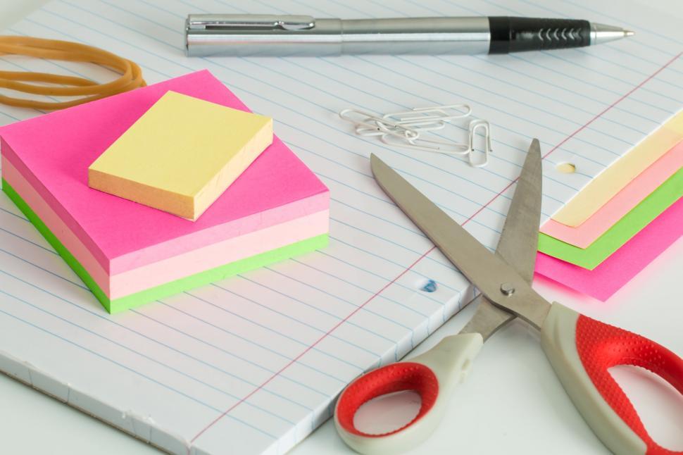 Free Image of post it notes desk clutter scissors pen elastic bands rubber bands workplace office note business memo sticky notes reminder sticky note remember notepad desk pad message sheet paper sticker page 