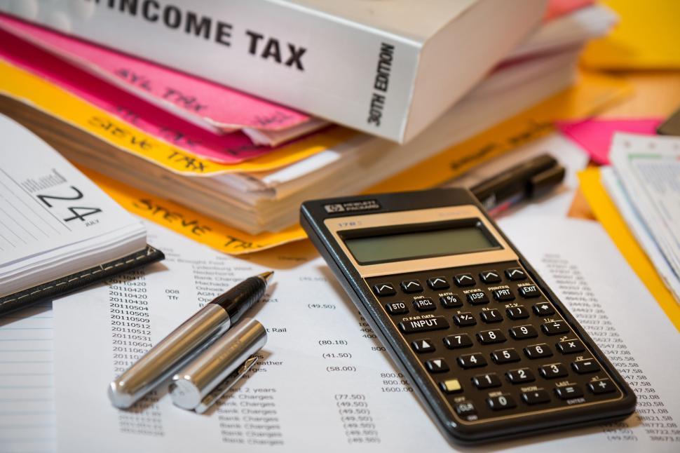 Free Image of income tax calculator accounting financial paperwork tax finance taxes calculate economy planning income investment irs budget business money office 