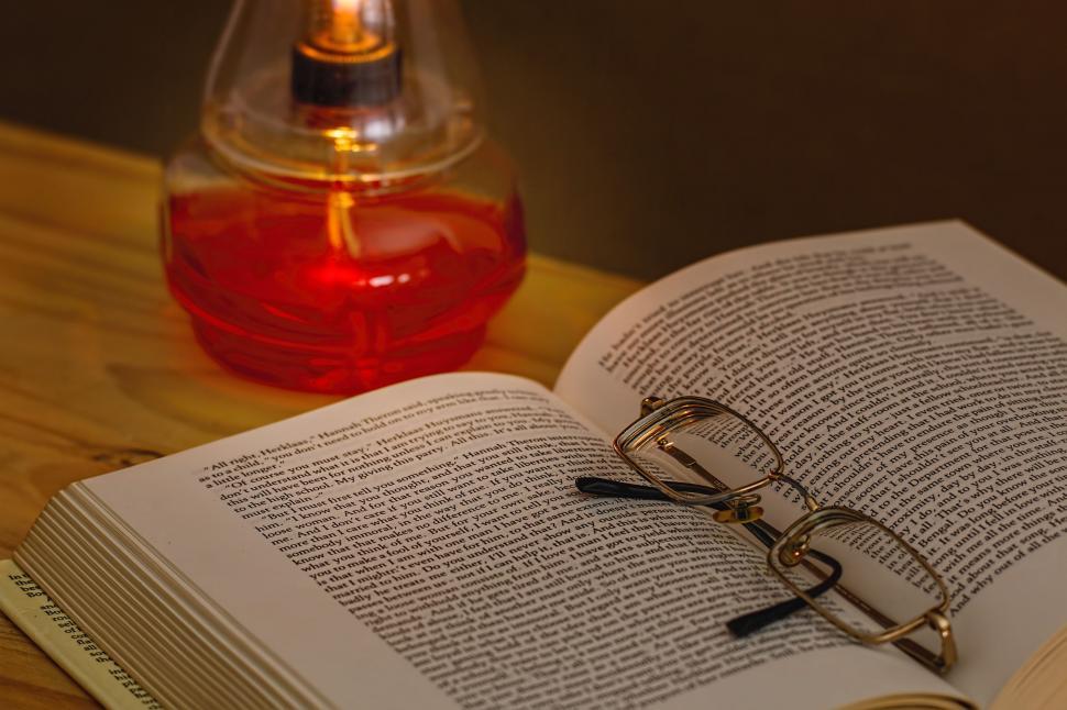Free Image of book oil lamp spectacles read reading glasses dark light night reading power failure evening illumination desk lamp simplicity inspiration story open book 