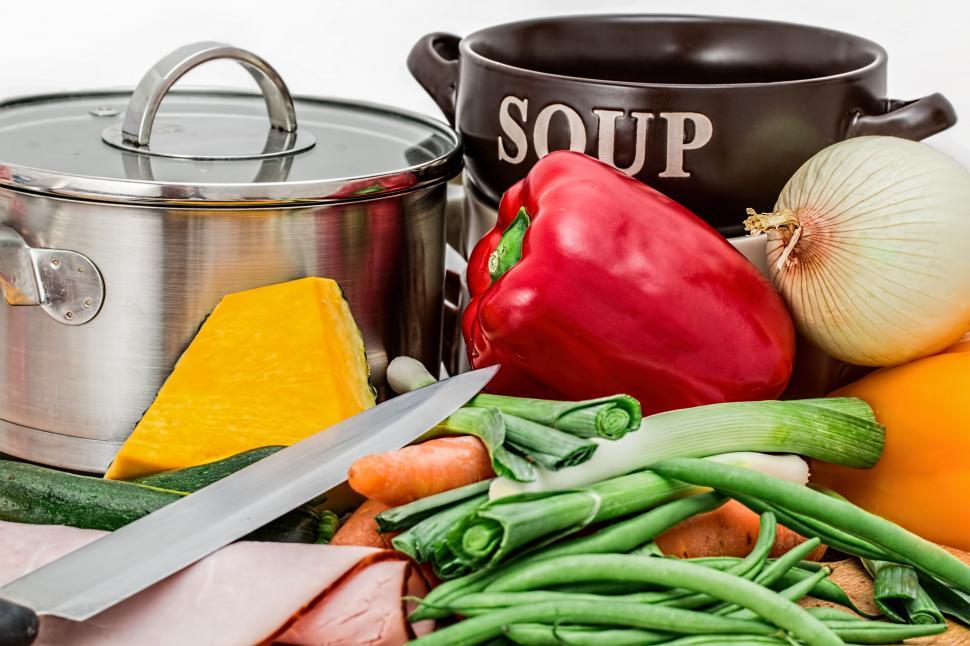 Free Image of soup vegetables pot cooking food healthy carrot onion bowl diet recipe pepper capsicum paprika leek beans knife nutrition homemade broth kitchen 