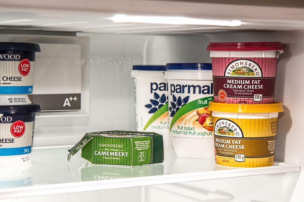 Free Image of Refrigerator Filled With Ice Cream and Yogurt 