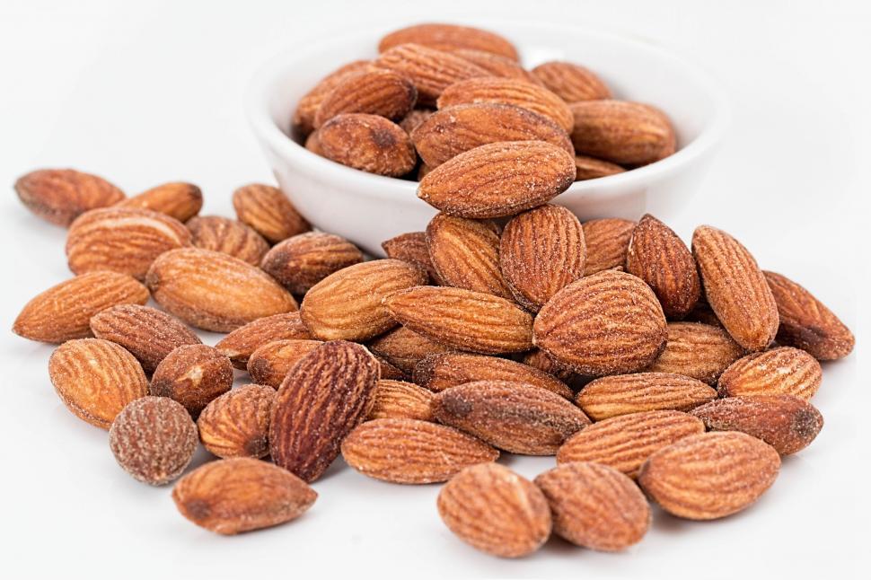 Free Image of almonds nuts roasted salted roasted nuts salted nuts salty snack snack healthy nutrition ingredient healthy eating organic vegetarian healthy diet food eating healthy healthy foods 